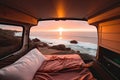 Sunset seen from back of camper van with beach landscape. Concept of nature and having freedom in holiday