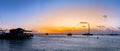 Sunset over the ocean on palm beach in Aruba`s West coast tourist destination Royalty Free Stock Photo