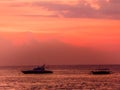 Indonesia - Boat and vulcano at sunset