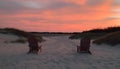Sunset Serenity: Beach Chairs at Dusk Royalty Free Stock Photo