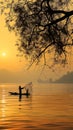 Sunset Serenity: Silhouette Fishing in the Golden Glow on the Lake Royalty Free Stock Photo