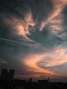 The sunset sets a beautiful light above the city clouds Royalty Free Stock Photo