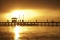 Sunset setting over pier Royalty Free Stock Photo