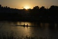 Sunset in Shavit anchorage on the banks of the Kishon River. View on Haifa. Rowers in canoeing