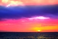 sunset and ship on horizontal ocean water surface colorful cloud Royalty Free Stock Photo