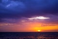 sunset and ship on horizontal ocean water surface colorful cloud Royalty Free Stock Photo