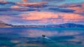 At Sunset a ship passing through the beautiful lake. Royalty Free Stock Photo