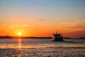 Sunset with ship sailing to the Brijuni Islands in Fazana, Croatia Royalty Free Stock Photo