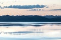 sunset shore of calm mountain lake