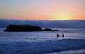 Sunset on shoreline below Heisler Park in Laguna Beach, California Royalty Free Stock Photo