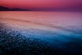 Sunset Shoreline Covered With Pebblestones