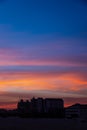 Sunset shot of a big city under an orange blue sky Royalty Free Stock Photo