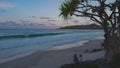 sunset shot of main beach with cape byron lighthouse in the distance Royalty Free Stock Photo