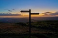 Way to go. Silhouetted signpost at dusk. Royalty Free Stock Photo