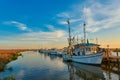 Sunset with shrimp boats along a dock at Tybee Island, Ga