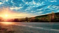 Sunset on the side of the country road Royalty Free Stock Photo