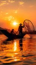 Sunset silhouette Asian fisherman on a wooden boat casts nets