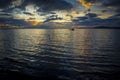 Sunset silhouette of a boat in Lake Nicaragua, seen from Ometepe Island Royalty Free Stock Photo