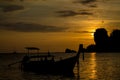 Sunset silhouette of boat in sea Railey bay in Thailand Royalty Free Stock Photo