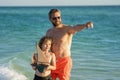 Sunset silhouette of father son dreaming on cruise. Father and son feeling adventure with boat. Friendly family dream on Royalty Free Stock Photo