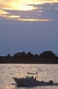 Sunset silhouette of fishing boat