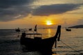 Sunset silhouette of fishing boat on sea beach in Thailand Royalty Free Stock Photo