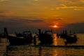 Sunset silhouette of fishing boats on sea beach in Thailand Royalty Free Stock Photo