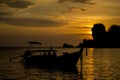 Sunset silhouette of long tail boat at sea bay in Thailand Royalty Free Stock Photo