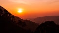 Sunset in the silhouette mountains