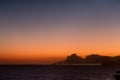 Sunset silhouette view of Gavea Stone in Rio de Janeiro seen from Itacoatiara beach. Niteroi, Rio de Janeiro
