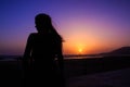 Sunset and silhouette of a woman Royalty Free Stock Photo