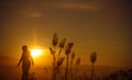 Sunset silhouette Young woman alone