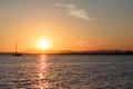 Sunset with a silhouetted boat Royalty Free Stock Photo