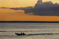 Sunset and silhouettes on boat cruising the Amazon River, Brazil