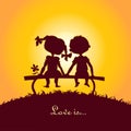 Sunset silhouettes of boy and girl Royalty Free Stock Photo