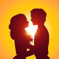 Sunset silhouettes of kissing couple Royalty Free Stock Photo