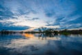 Sunset silhouetting a flooded jungle in Laguna Grande, in the Cuyabeno Wildlife Reserve, Amazon Basin, Ecuador