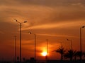 Burning sunset, red sky and sillouettes