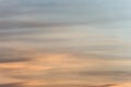 Sunset sky background with a golden orange glow on a hazy clouds Royalty Free Stock Photo