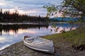 Sunset sky and canoe at Teslin River Yukon Canada Royalty Free Stock Photo