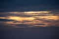 Sunset sky with clouds and orange and blue tones Royalty Free Stock Photo