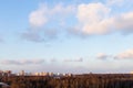 Sunset sky with clouds over city park and houses Royalty Free Stock Photo