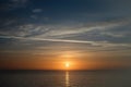 Sunset sky clouds vertical over sea in the evening with colorful orange sunlight reflect on the sea landscape with summer travel Royalty Free Stock Photo