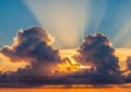 Sunset sky with dramatic clouds and sun rays streaming through. Royalty Free Stock Photo