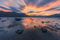 Sunset sky on fire with orange explosion of colours at golden hour time over the Lake Wanaka in New Zealand Royalty Free Stock Photo