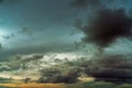 Sunset sky and gray and golden clouds. Gray sky and fluffy clouds. Thunder and storm sky. Sad and moody sky. Dead abstract