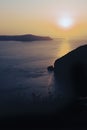 Sunset sky lighting a coastal landscape in Santorini