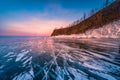 Sunset sky with natural breaking ice over frozen water on Lake Baikal, Siberia, Russia Royalty Free Stock Photo