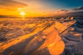 Sunset sky with natural breaking ice over frozen water on Lake Baikal, Siberia, Russia Royalty Free Stock Photo