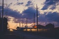 Sunset sky over the empty outskirts. View of the country street at dusk. Tinted photo